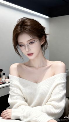 Woman with brown hair and glasses wearing an off-shoulder sweater indoors