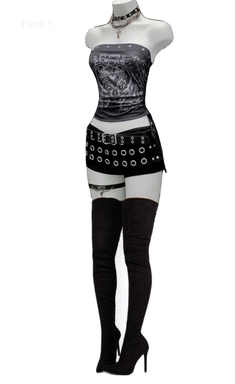 Mannequin dressed in a gothic-style outfit with a strapless top and thigh-high boots