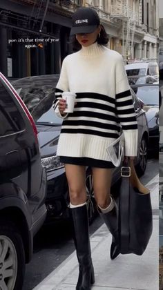 Woman in a striped turtleneck sweater and mini skirt walking on a street