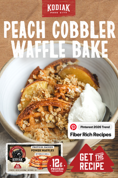 Peach cobbler waffle bake with whipped cream and oat topping in a bowl