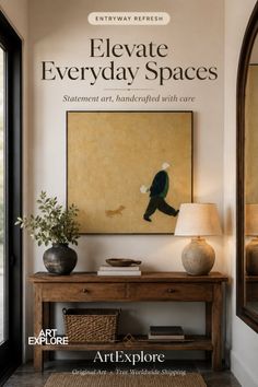 An entryway with a wooden console table, a lamp, and a painting on the wall