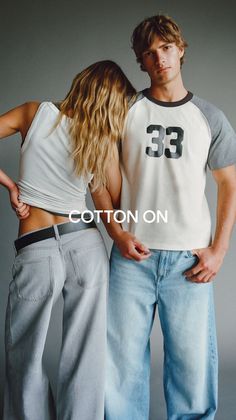 Two people in casual wear, woman leaning on man's shoulder