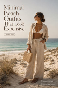Woman in a bikini top and linen outfit on a sandy beach