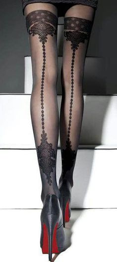 Woman's legs in black patterned stockings and high heels with red soles