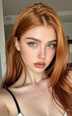 Woman with red hair and green eyes in a close-up portrait