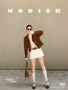 Woman in a brown jacket and white mini skirt posing outdoors