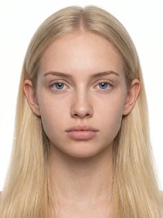Woman with blonde hair and blue eyes against a white background