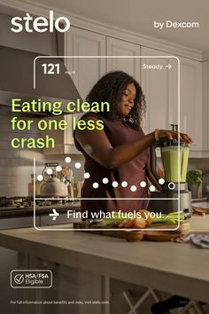 Woman making a green smoothie in a modern kitchen