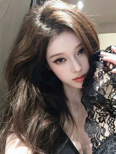 Woman with long hair holding black lace near her face
