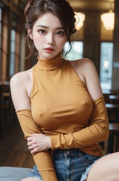 Woman in a mustard turtleneck top and denim shorts indoors