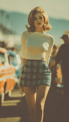 Woman in a plaid skirt and white top with a vintage hairstyle outdoors