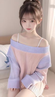 Woman with a hair bun wearing an off-shoulder pastel sweater indoors