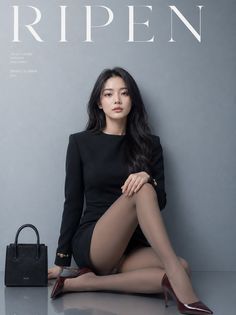 Woman in a black dress and pantyhose posing for a fashion magazine cover