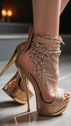 Close up of a person wearing sparkling gold platform high heels with rhinestone embellishments