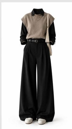 Full body shot of a casual outfit with a black shirt and wide leg pants