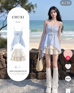 Woman in a blue gingham dress and white leg warmers on a beach