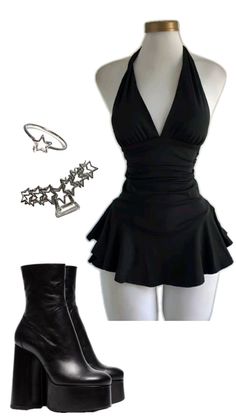 Black halter neck dress with platform boots and star accessories