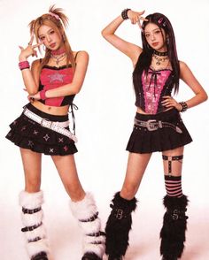Two women in punk-inspired outfits with mini skirts and furry boots