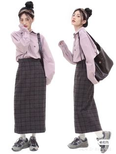 Woman in a plaid skirt and long sleeve shirt with a shoulder bag