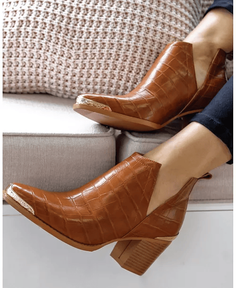 Brown ankle boots with crocodile texture and gold accents