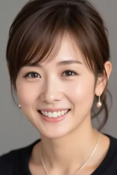 Woman with brown hair and pearl earrings smiling at the camera