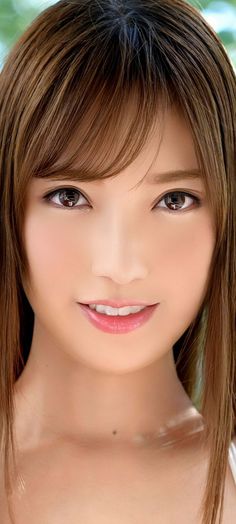 Close up portrait of a smiling woman with long brown hair