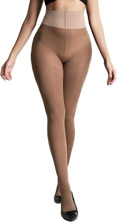 Woman wearing nude colored tights and a black bra with black heels