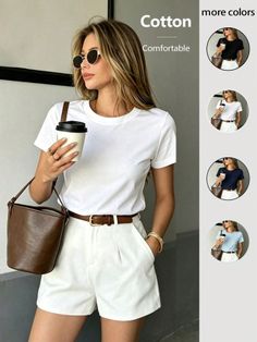 Woman in a white t-shirt and shorts holding a coffee cup