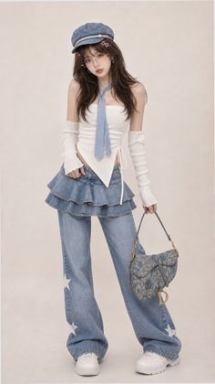 Woman in a denim hat, white tube top, and denim jeans with a ruffle skirt