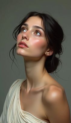 Woman with dark hair looking up, with soft lighting on her face and shoulders