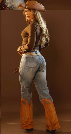 Woman in a cowboy hat and jeans with cowboy boot details