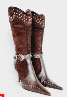 Pair of brown high-heeled boots with studded details and buckle straps