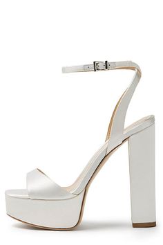 White satin platform heels with an ankle strap and chunky heel