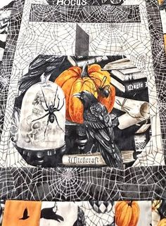 Halloween themed quilted fabric with pumpkins, crows, spiders, and skulls