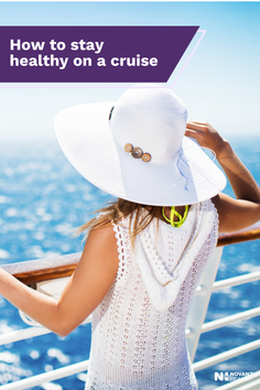 Woman in a white sun hat on a cruise ship deck looking at the ocean