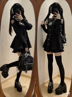 Person in a black dress and platform shoes posing in front of a mirror