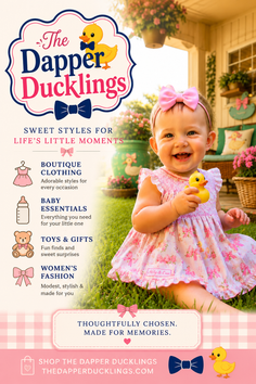 Happy baby in a pink dress holding a rubber duck on the grass