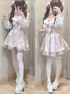 Person in a pink lolita dress with pigtails and thigh-high socks