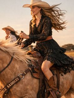 Two women riding horses at golden hour, with one in a black lace dress and cowboy hat