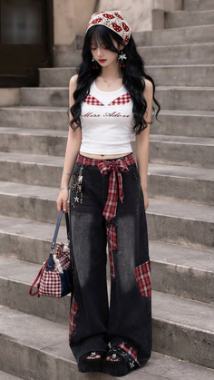 Woman with long black hair wearing a bandana and plaid pants