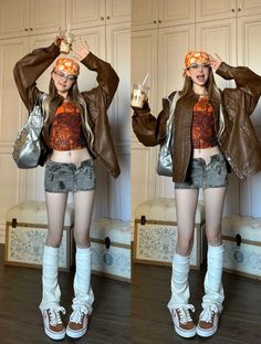 Woman in a brown leather jacket and denim mini skirt posing indoors