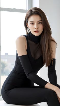 Woman with long hair in a black sheer top and matching arm sleeves