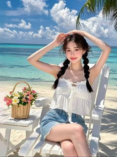 Woman with braided hair sitting on a beach chair with a flower basket