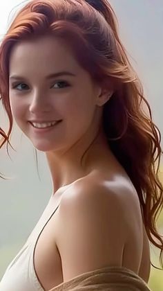 Smiling woman with long red hair and bare shoulders