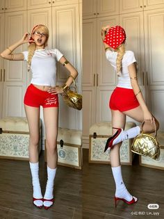 Woman in red shorts and a white t-shirt posing indoors