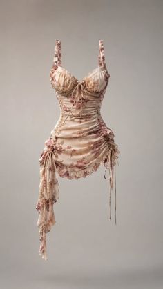 Light pink floral mini dress with ruched fabric and spaghetti straps