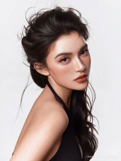 Woman with black hair and a black top looking at the camera