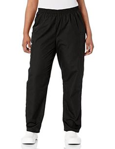 Person wearing black scrub pants with an elastic waist and white shoes