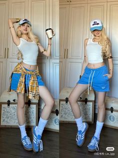 Woman with long blonde hair in a white tank top and blue shorts indoors
