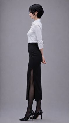 Woman with short black hair in a white shirt and black skirt with a slit